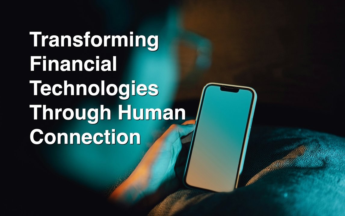 A hand holding a glowing phone in the dark — Transforming Financial Technologies Through Human Connection